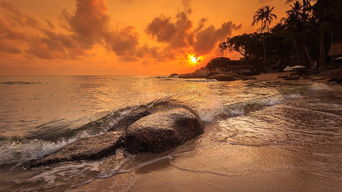 Dramatic sunset over Thong Nai Pan beach rocks, Koh Phangan